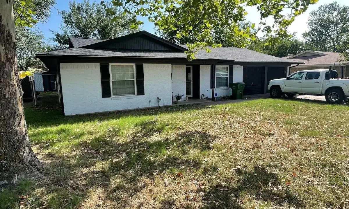 Professional roofing crew working on a residential roof in Sheffield Lake